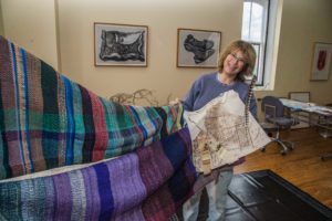 Union Bridge artist Jo Israelson displays some of the weavings to make a symbolic tent for her recent exhibit, “Welcoming the Stranger”, in the JewishMuseum of Maine.