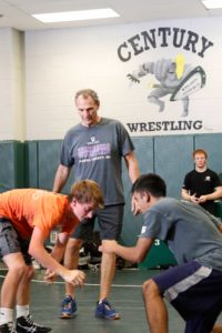 Carroll County Commissioner Dennis Frazier coaching wrestling at Century High School.