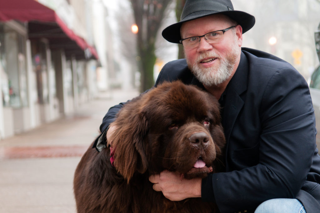 Mike McMullin with his Newfoundland, Henri.